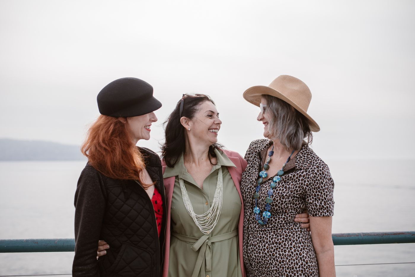 Three mature women sharing a warm moment together